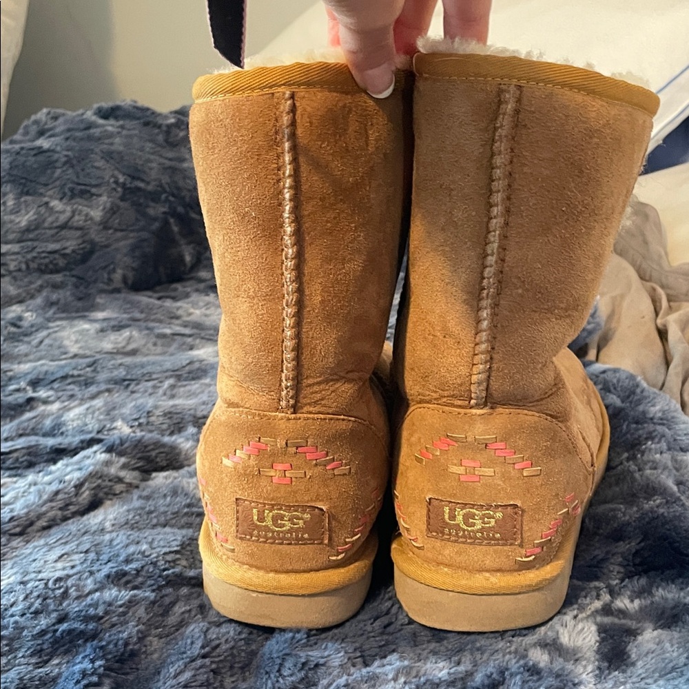 UGG Tan Suede Boots with Pink detail on the back.